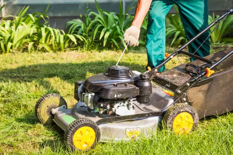 Definition of backfiring in a lawn mower 